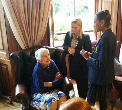 Upper Fifth students visitng the residents of Winscombe Hall