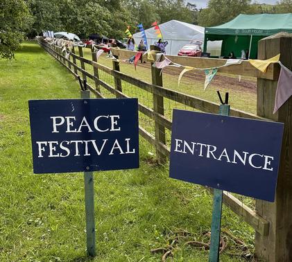 Peace Festival sign outside entrance to field