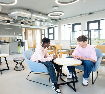 Two boys sitting in Sidcot Sixth Form common room