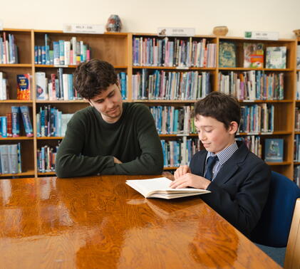 a teacher helping a child who may be experiencing SATs stress