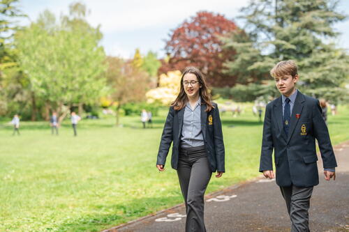 two private school students walking and discussing how to choose a private school