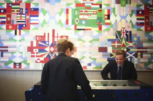 Senior boarding pupils playing a game of pool at our private school near Bristol, welcoming families both from the wider Somerset area & internationally.