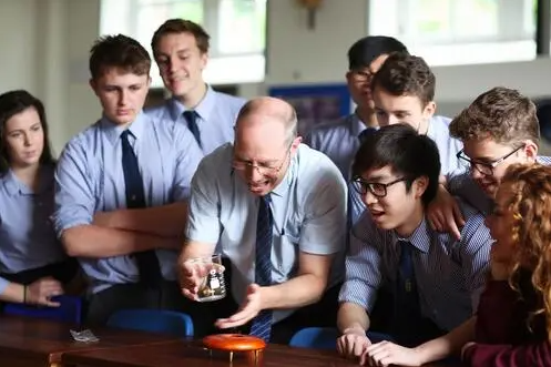 Senior students conducting a science experiment with  teacher at our prviate boarding school near Bristol, students from Bath and the wider Somerset areas.